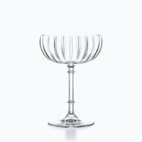 Coupette en verre transparent à buvant côtelé, tige annelée et base ronde