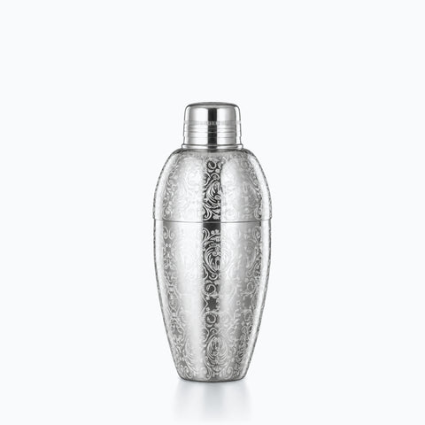 Shaker à cocktail argent en acier poli, corps ovoïde gravé de rinceaux baroques