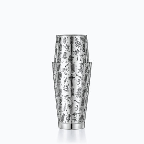 Shaker gravé en inox poli miroir, couvert de motifs tiki et tropicaux