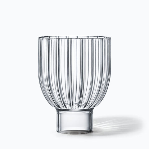 Verre à pied bas Melon seul sur fond blanc, ombre portée