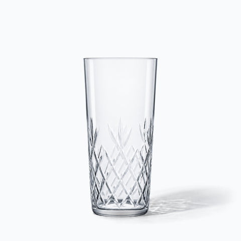 Verre long drink Palmette taillé en losanges seul sur fond blanc avec son ombre portée